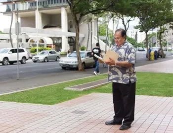 man reading folder